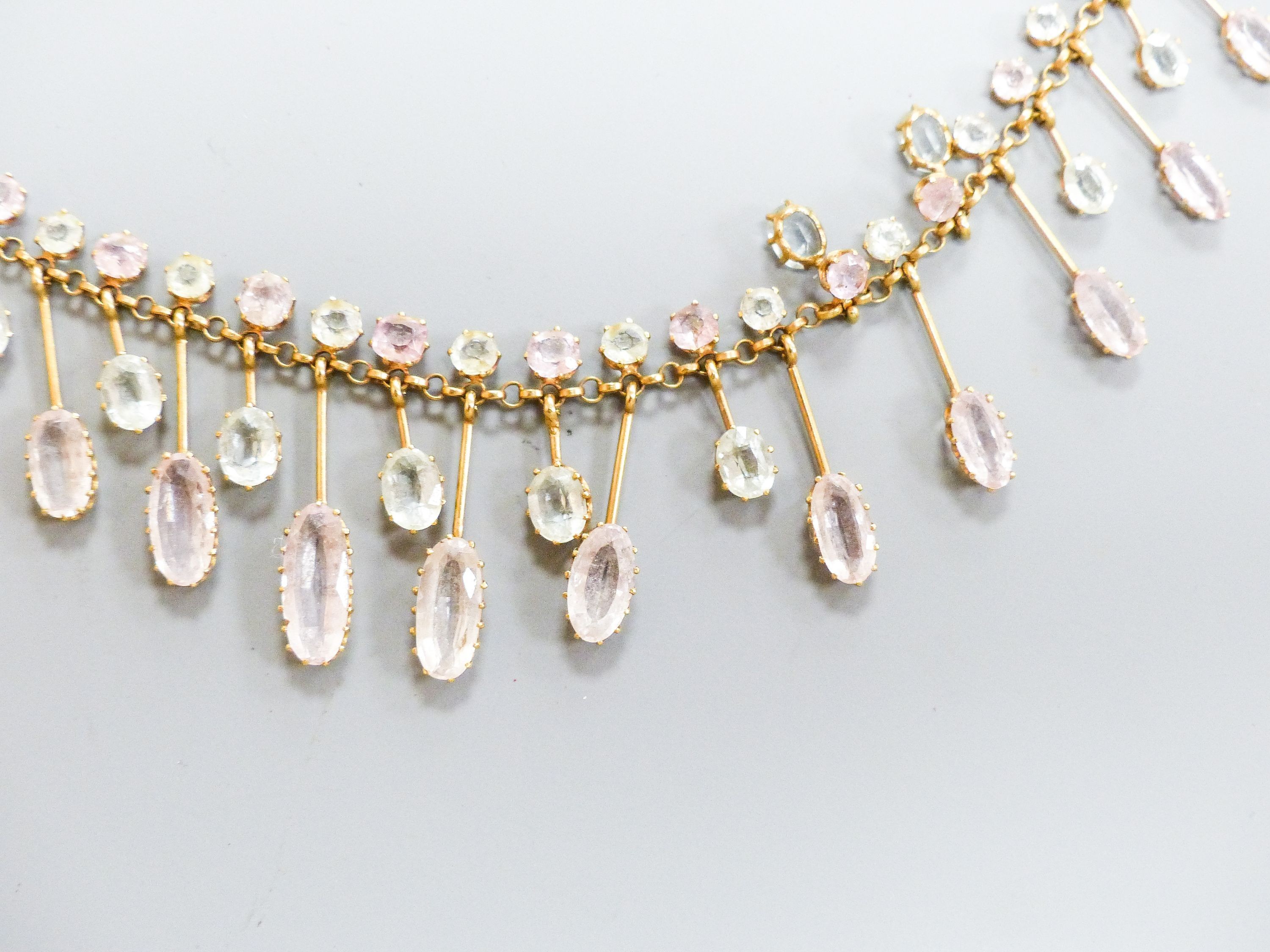 A 9k, aquamarine and pink topaz set drop fringe necklace, approx. 46cm